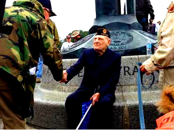 "Later in the morning, veteran Mike Lauriente was accepting handshakes from demonstrators. He served in Sicily and French Morocco, and declared the memorial, which he was seeing for the first time, beautiful. "The spirit that I see here is overwhelming."  - WTOP