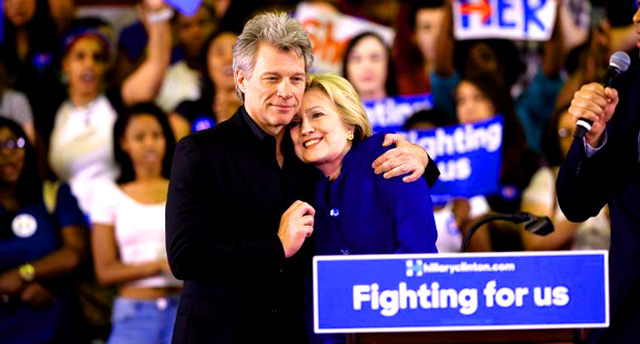 Singer Jon Bon Jovi embraces Hillary Clinton during a campaign rally at Rutgers University in Newark, N.J., on June 1, 2016.  - PJMedia
