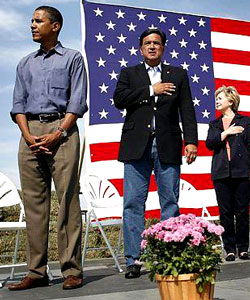 Obama, when asked about this picture said that flag pins and putting your hand over your heart had no meaning for love of country.  Really?  Then why during his campaign for president suddenly he had flags surround him on the stage, in his logo, and on his coat at every debate?  Liar, liar, pants on fire!  