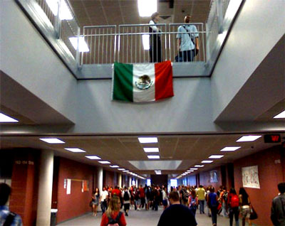 When student took Mexican flag displayed in a Texas high school, the school's princple pitched a fit, reviewed the surveillance tapes, found the student, and suspended him for 3 days.  AND the student had to pay for the flag.  How do you get to the top of stairs without being seen?  One small step at a time.   